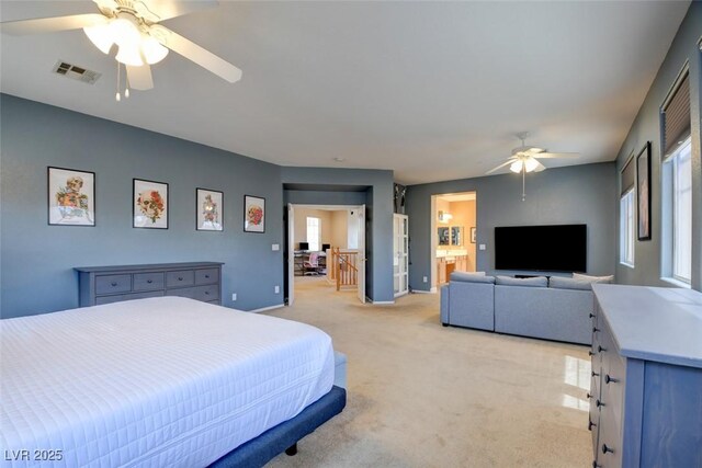 98 Milicity Rd, Henderson, NV 89012 - bedroom with light colored carpet, multiple windows, and a ceiling fan