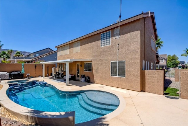 98 Milicity Rd, Henderson, NV 89012 - view of swimming pool with a patio area, a fenced backyard, a pool with connected hot tub, and a gate