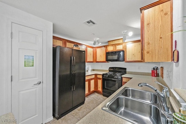 6868 Sky Pointe Dr Unit 1107, Las Vegas, NV 89131 - kitchen featuring black appliances, light tile patterned floors, and light countertops