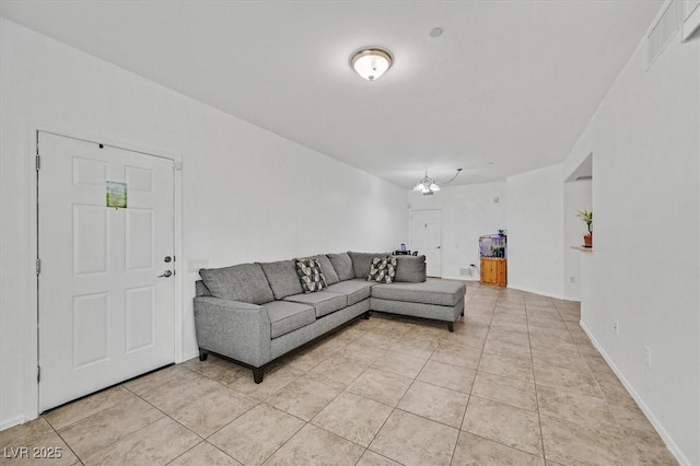 6868 Sky Pointe Dr Unit 1107, Las Vegas, NV 89131 - living room featuring light tile patterned floors and baseboards