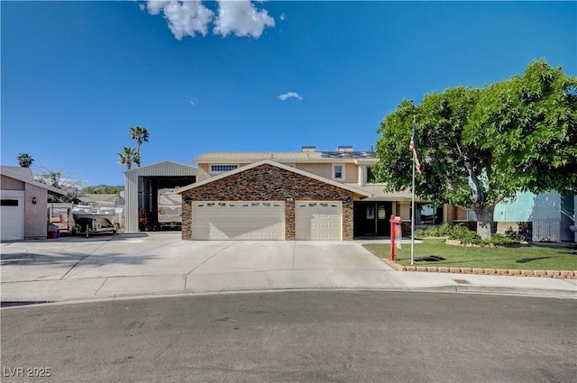 902 Dianne Dr, Boulder City, NV 89005 - view of front of house with a garage, a front lawn, driveway, and stucco siding