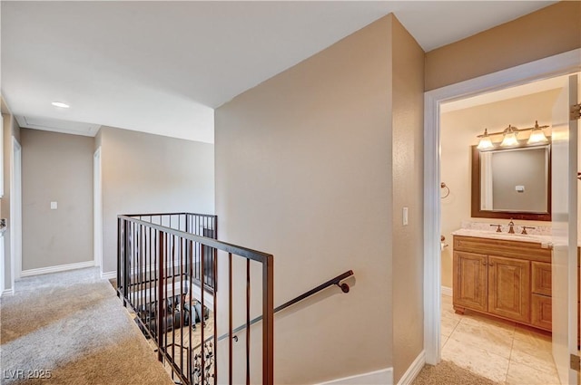902 Dianne Dr, Boulder City, NV 89005 - corridor featuring an upstairs landing and light carpet
