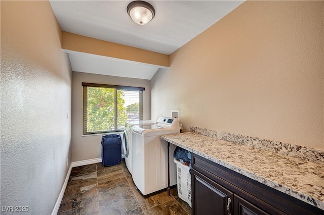 902 Dianne Dr, Boulder City, NV 89005 - laundry area featuring washer and dryer, cabinet space, and dark stone finish flooring