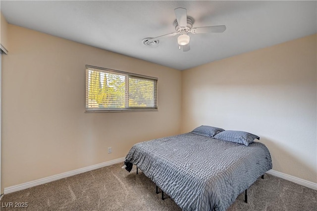 902 Dianne Dr, Boulder City, NV 89005 - carpeted bedroom with baseboards and ceiling fan