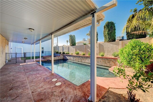 902 Dianne Dr, Boulder City, NV 89005 - view of swimming pool featuring a fenced backyard, a patio area, and a pool with connected hot tub