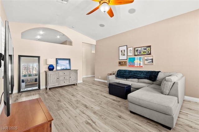9733 Northern Dancer Dr, Las Vegas, NV 89117 - living room with lofted ceiling, a ceiling fan, and light wood-type flooring