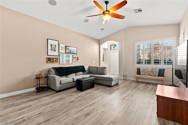 9733 Northern Dancer Dr, Las Vegas, NV 89117 - living area with light wood-style flooring, arched walkways, ceiling fan, and vaulted ceiling