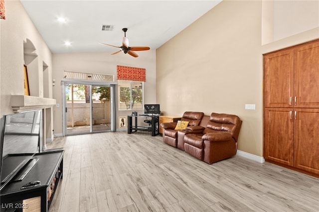 9733 Northern Dancer Dr, Las Vegas, NV 89117 - living room featuring ceiling fan, light wood-style flooring, and high vaulted ceiling