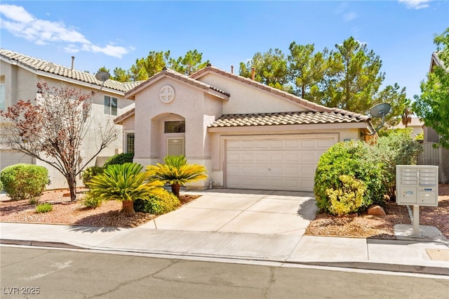 9733 Northern Dancer Dr, Las Vegas, NV 89117 - mediterranean / spanish-style home with an attached garage, a tiled roof, driveway, and stucco siding