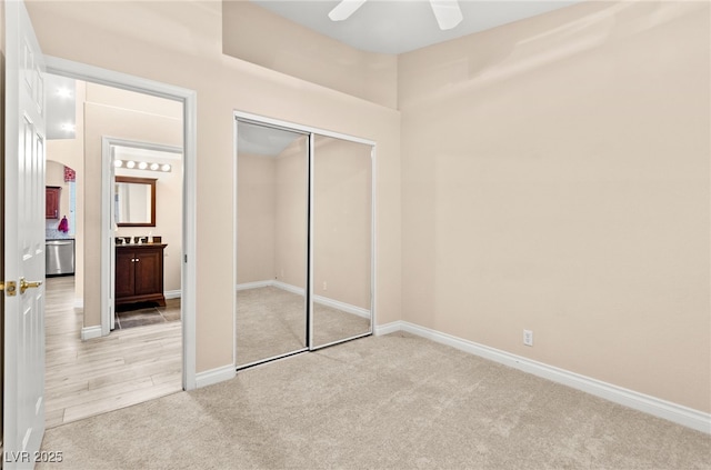 9733 Northern Dancer Dr, Las Vegas, NV 89117 - unfurnished bedroom with light colored carpet, a closet, and a ceiling fan