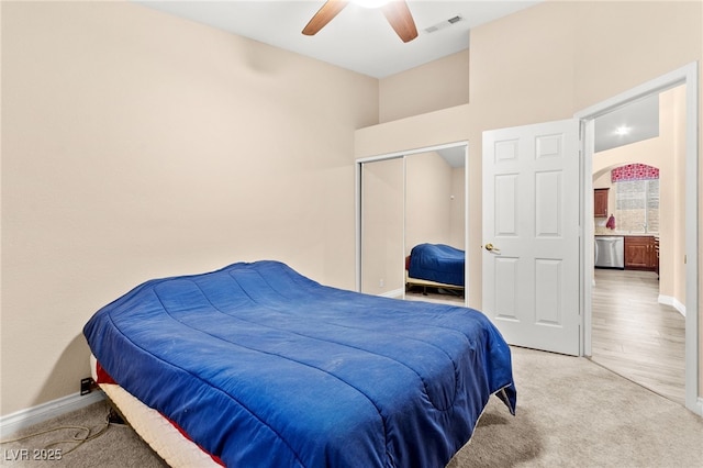 9733 Northern Dancer Dr, Las Vegas, NV 89117 - bedroom with light carpet, a closet, ceiling fan, and a towering ceiling