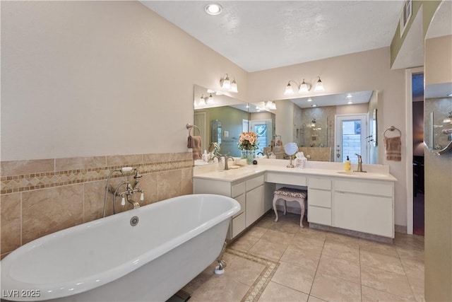 3361 Iberia St, Las Vegas, NV 89146 - bathroom featuring double vanity, a soaking tub, a shower stall, tile patterned floors, and inlaid floor details