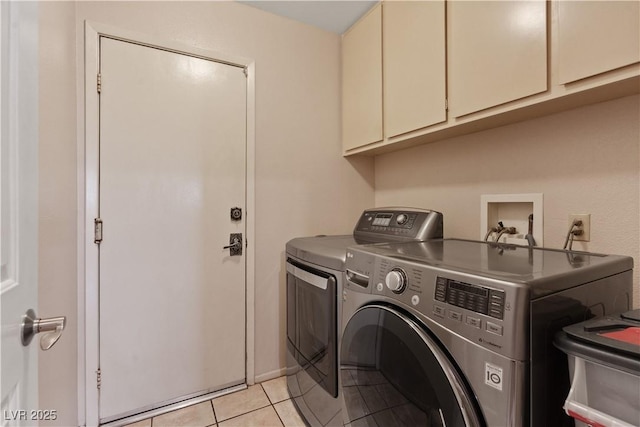 3361 Iberia St, Las Vegas, NV 89146 - laundry area featuring cabinet space, washing machine and clothes dryer, and light tile patterned floors