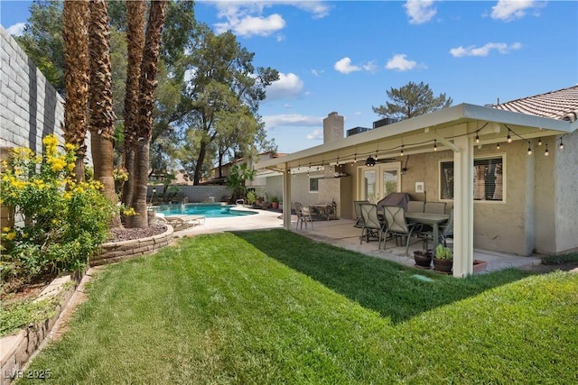 3361 Iberia St, Las Vegas, NV 89146 - fenced backyard with a patio area, a ceiling fan, and french doors