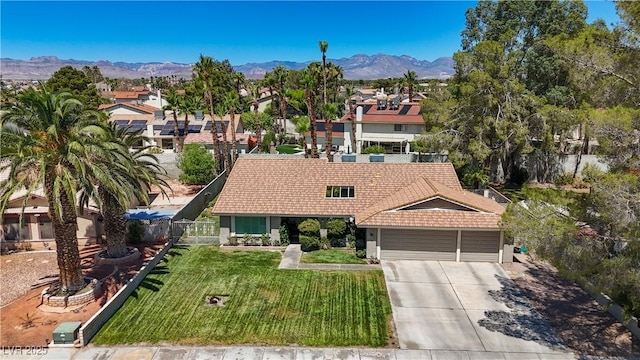 3361 Iberia St, Las Vegas, NV 89146 - view of front of property with a tile roof, an attached garage, driveway, and a mountain view