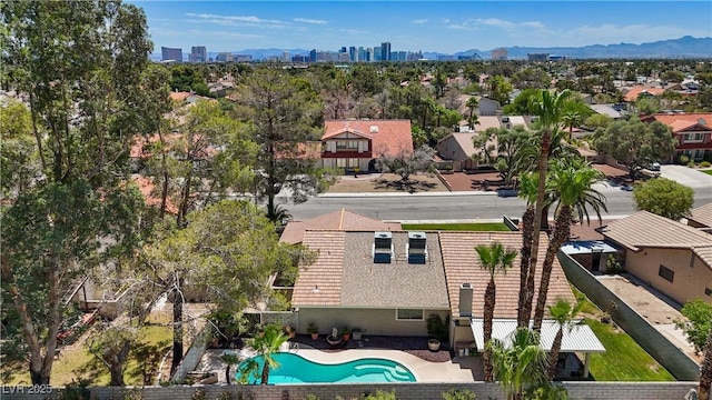 3361 Iberia St, Las Vegas, NV 89146 - aerial perspective of suburban area featuring a pool and a mountainous background