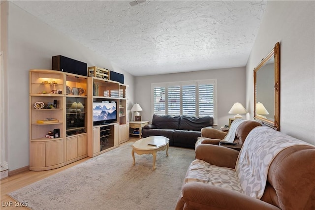 3361 Iberia St, Las Vegas, NV 89146 - living area featuring a textured ceiling and light wood finished floors