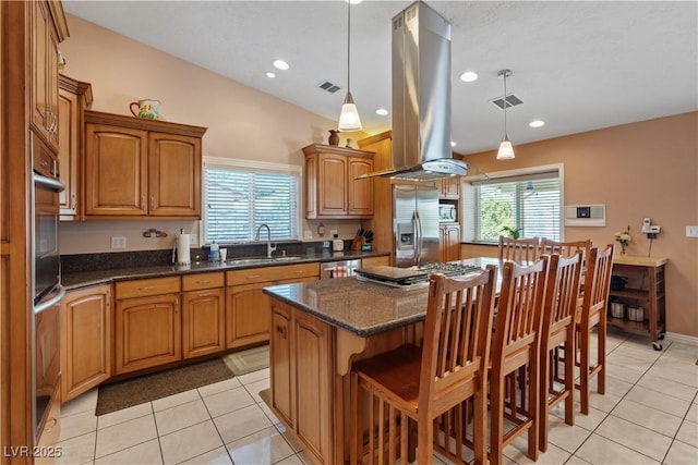 3361 Iberia St, Las Vegas, NV 89146 - kitchen with stainless steel appliances, island range hood, light tile patterned floors, plenty of natural light, and recessed lighting