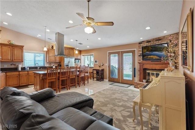 3361 Iberia St, Las Vegas, NV 89146 - living room featuring a ceiling fan, light tile patterned floors, recessed lighting, and vaulted ceiling