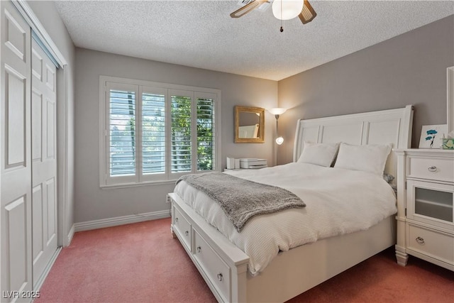 3361 Iberia St, Las Vegas, NV 89146 - bedroom featuring carpet flooring, a closet, a textured ceiling, and a ceiling fan
