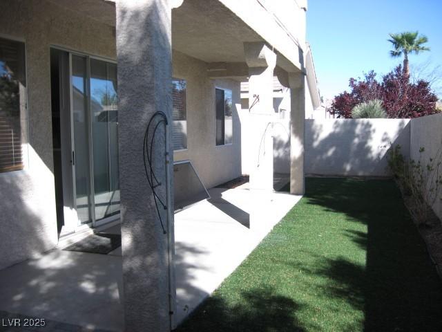 254 Horizon Pointe Cir, Henderson, NV 89012 - fenced backyard with a patio