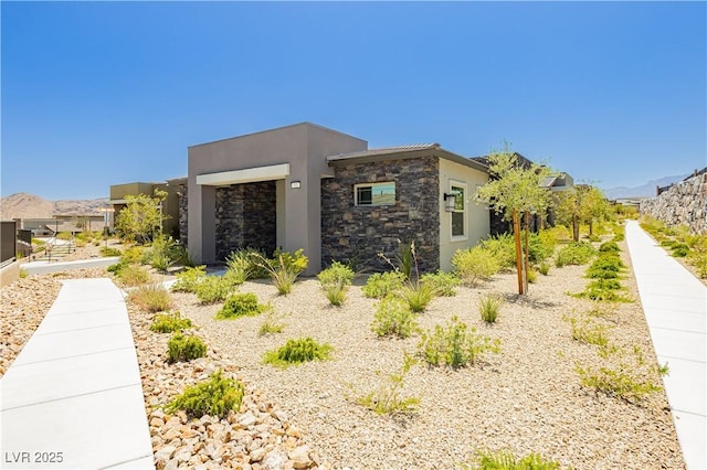 901 Allister Fields Ln, Las Vegas, NV 89138 - view of side of home featuring stucco siding and stone siding