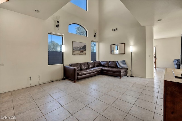 8421 Cheerful Brook Ave, Las Vegas, NV 89143 - living area with light tile patterned floors and a towering ceiling