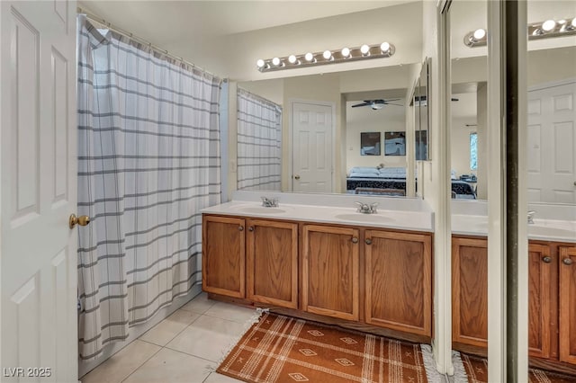 8421 Cheerful Brook Ave, Las Vegas, NV 89143 - bathroom with connected bathroom, double vanity, ceiling fan, and tile patterned flooring