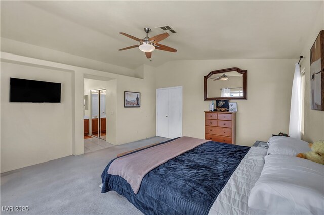 8421 Cheerful Brook Ave, Las Vegas, NV 89143 - bedroom featuring light colored carpet, a ceiling fan, lofted ceiling, and ensuite bath