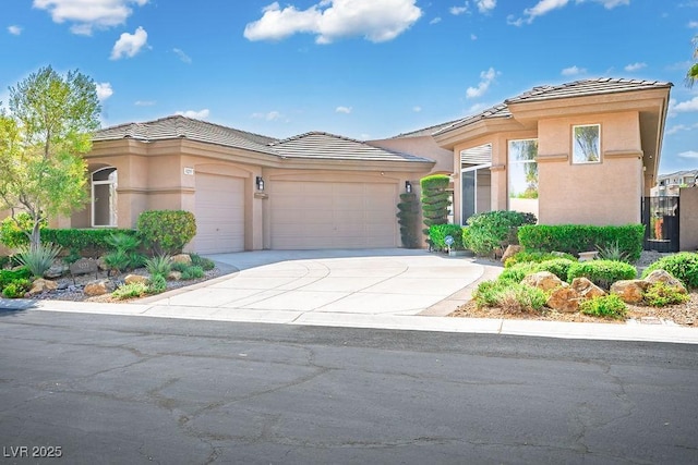 9233 Canyon Mesa Dr, Las Vegas, NV 89144 - prairie-style home with a tiled roof, stucco siding, a garage, and driveway