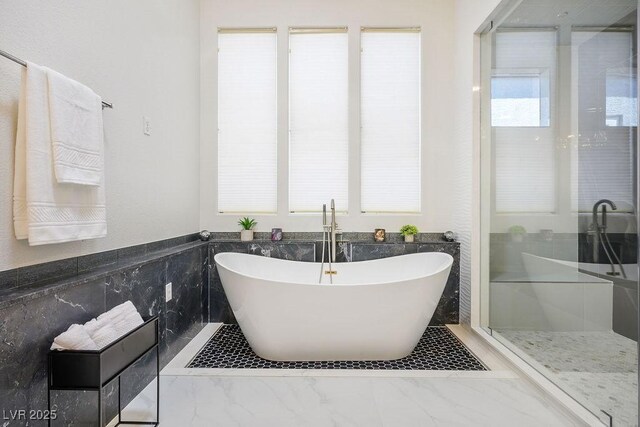 9233 Canyon Mesa Dr, Las Vegas, NV 89144 - full bath featuring a freestanding tub, marble finish floors, and a stall shower