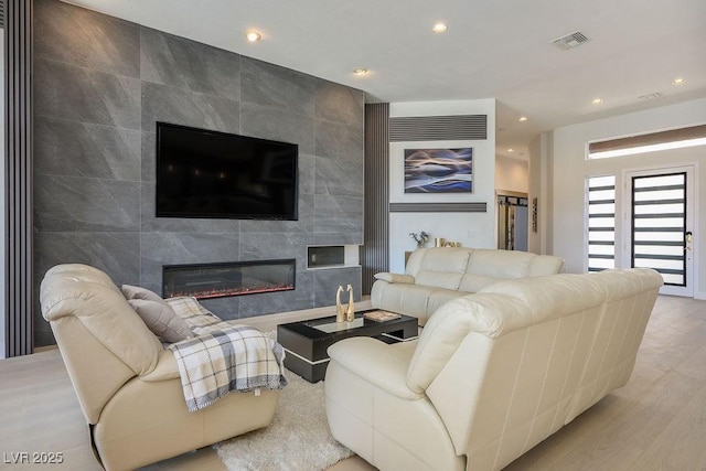 9233 Canyon Mesa Dr, Las Vegas, NV 89144 - living room with a fireplace, recessed lighting, and wood finished floors