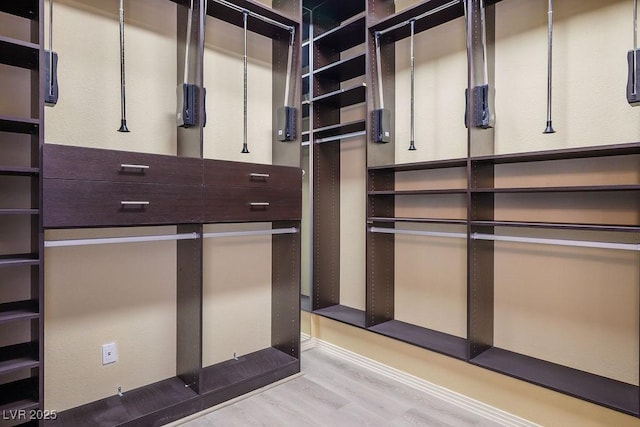9233 Canyon Mesa Dr, Las Vegas, NV 89144 - walk in closet with wood finished floors