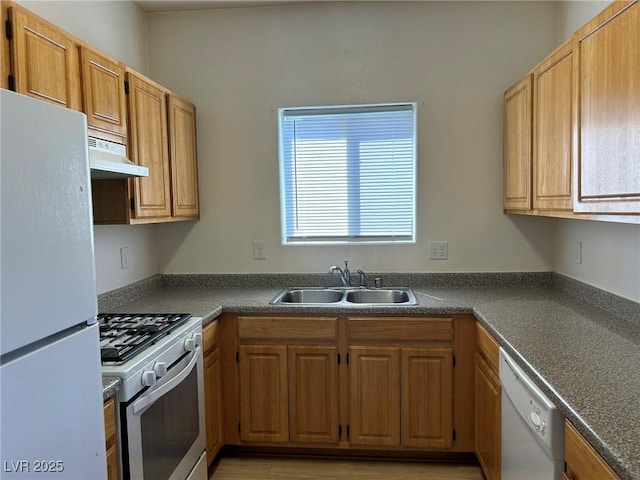 5650 E Sahara Ave Unit 2007, Las Vegas, NV 89142 - kitchen featuring white appliances, under cabinet range hood, and dark countertops