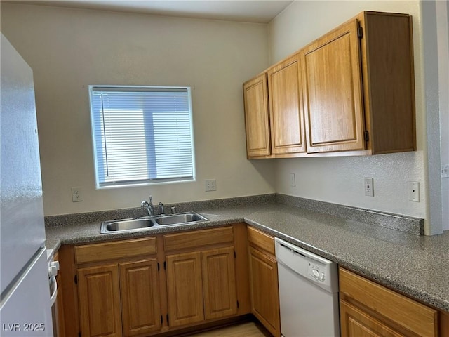 5650 E Sahara Ave Unit 2007, Las Vegas, NV 89142 - kitchen with white appliances, dark countertops, and brown cabinets