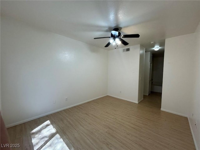 5650 E Sahara Ave Unit 2007, Las Vegas, NV 89142 - empty room featuring light wood-style floors and a ceiling fan