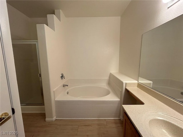 5650 E Sahara Ave Unit 2007, Las Vegas, NV 89142 - bathroom with a garden tub, a stall shower, and vanity