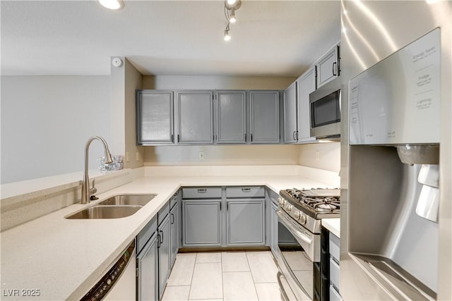 2633 S Durango Dr Unit 202, Las Vegas, NV 89117 - kitchen featuring appliances with stainless steel finishes, gray cabinets, light tile patterned floors, and light countertops