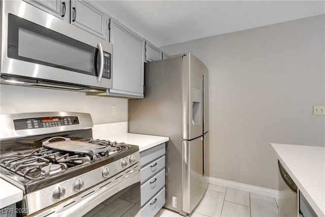 2633 S Durango Dr Unit 202, Las Vegas, NV 89117 - kitchen with appliances with stainless steel finishes, gray cabinets, and light countertops