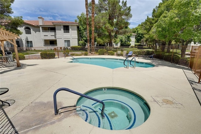 2633 S Durango Dr Unit 202, Las Vegas, NV 89117 - community pool with a hot tub and a patio