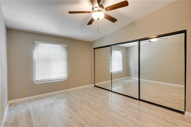 2633 S Durango Dr Unit 202, Las Vegas, NV 89117 - unfurnished bedroom with vaulted ceiling, light wood-style flooring, a closet, and ceiling fan