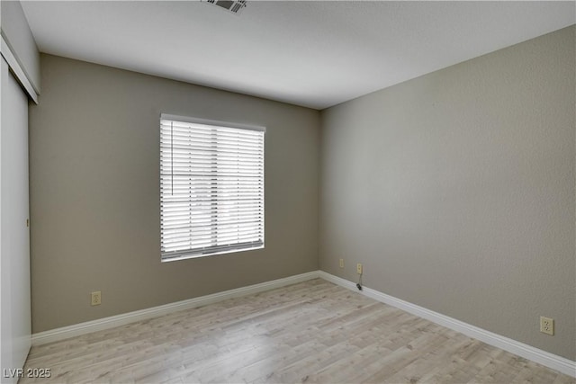 2633 S Durango Dr Unit 202, Las Vegas, NV 89117 - spare room with light wood-style floors and baseboards