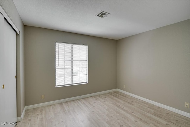 2633 S Durango Dr Unit 202, Las Vegas, NV 89117 - spare room featuring light wood-style floors and baseboards