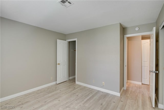 2633 S Durango Dr Unit 202, Las Vegas, NV 89117 - unfurnished bedroom featuring light wood finished floors and baseboards