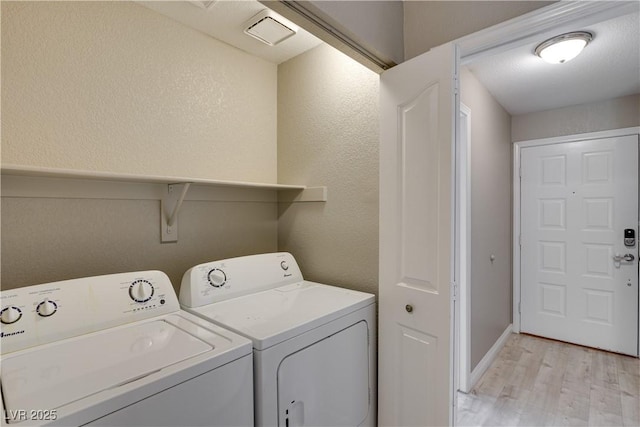 2633 S Durango Dr Unit 202, Las Vegas, NV 89117 - washroom featuring washer and dryer and light wood-style floors