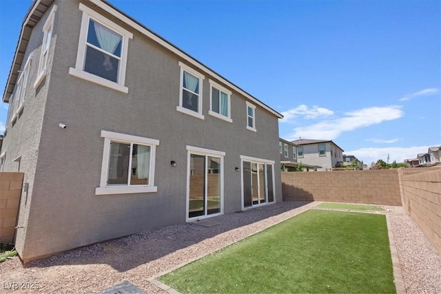 10058 Matter Overlook Dr, Las Vegas, NV 89178 - rear view of property with stucco siding and a fenced backyard