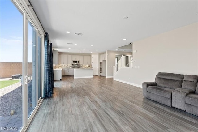 10058 Matter Overlook Dr, Las Vegas, NV 89178 - living area with stairs, wood finished floors, and recessed lighting