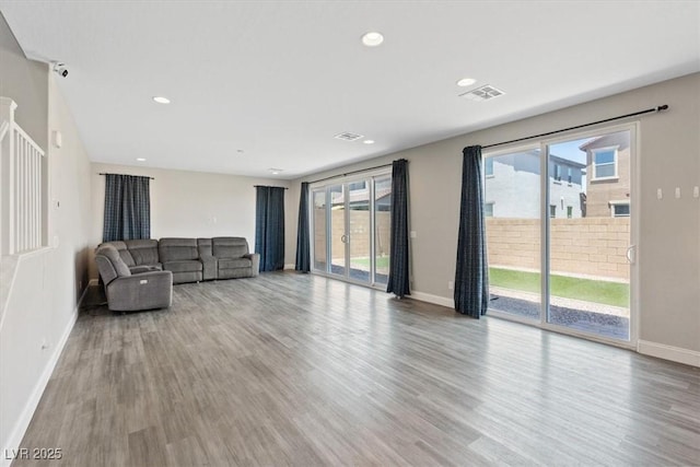 10058 Matter Overlook Dr, Las Vegas, NV 89178 - unfurnished living room with wood finished floors and recessed lighting