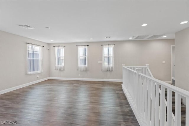 10058 Matter Overlook Dr, Las Vegas, NV 89178 - empty room featuring recessed lighting, healthy amount of natural light, and dark wood finished floors