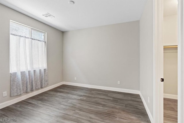 10058 Matter Overlook Dr, Las Vegas, NV 89178 - unfurnished bedroom featuring baseboards and dark wood finished floors